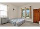 Guest bedroom with double bed, dresser, and wardrobe at 7650 Wandering Way, Orlando, FL 32836