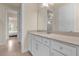 Clean bathroom, featuring a white vanity and tan countertop at 7650 Wandering Way, Orlando, FL 32836