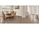 Formal dining room with wood table and floral chairs at 7650 Wandering Way, Orlando, FL 32836