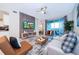 Living room with balcony access, comfortable seating and a large TV at 3131 Paradox Cir # 108, Kissimmee, FL 34746