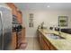 Kitchen with granite countertops, stainless steel appliances, and island at 4825 Clock Tower Dr, Kissimmee, FL 34746