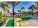Enjoy a round of mini golf with palm trees and landscaping at 4825 Clock Tower Dr, Kissimmee, FL 34746