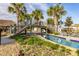 Relaxing lazy river with wooden bridge and surrounding landscaping at 4825 Clock Tower Dr, Kissimmee, FL 34746