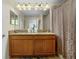 Double vanity bathroom with granite countertop at 4825 Clock Tower Dr, Kissimmee, FL 34746