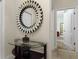 Entryway featuring a large circular mirror and console table at 4825 Clock Tower Dr, Kissimmee, FL 34746