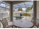Relaxing patio furniture with pool view at 4825 Clock Tower Dr, Kissimmee, FL 34746