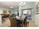 Dining area with a dark wood table and chairs, access to a patio at 4825 Clock Tower Dr, Kissimmee, FL 34746