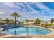 Relaxing community pool with plenty of lounge chairs at 4825 Clock Tower Dr, Kissimmee, FL 34746