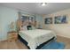Bright bedroom with king-size bed and wall art at 4825 Clock Tower Dr, Kissimmee, FL 34746