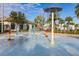 Interactive splash pad with various water features at 4825 Clock Tower Dr, Kissimmee, FL 34746