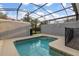 Private screened pool and spa with grill at 4825 Clock Tower Dr, Kissimmee, FL 34746