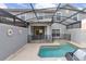 Private screened pool and patio area with grill at 4825 Clock Tower Dr, Kissimmee, FL 34746