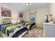 Twin bedroom with Minion bedding and TV at 4825 Clock Tower Dr, Kissimmee, FL 34746