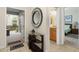 Entryway with a large mirror, console table, and views into rooms at 4825 Clock Tower Dr, Kissimmee, FL 34746