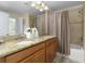 Double sink bathroom with granite countertop and bathtub at 4825 Clock Tower Dr, Kissimmee, FL 34746