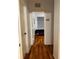 Hallway with wood flooring leading to bedroom at 6141 Metrowest E Blvd # 303, Orlando, FL 32835