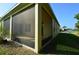 Spacious screened porch, perfect for relaxing outdoors at 2221 The Oaks Blvd, Kissimmee, FL 34746