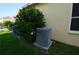Close up of AC unit next to the house at 2221 The Oaks Blvd, Kissimmee, FL 34746