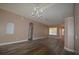 Elegant living room with chandelier and hardwood floors at 2221 The Oaks Blvd, Kissimmee, FL 34746