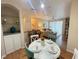 Bright dining area with a round table and chairs at 8826 Dunes Ct # 207, Kissimmee, FL 34747