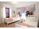 Cozy bedroom with two twin beds and Frozen-themed wall at 2022 Majorca Dr, Kissimmee, FL 34747