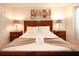 Serene bedroom with king-size bed and wooden headboard at 2022 Majorca Dr, Kissimmee, FL 34747
