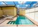Private screened pool and patio with lounge chairs at 2022 Majorca Dr, Kissimmee, FL 34747