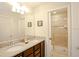 Modern bathroom with double vanity and shower at 2022 Majorca Dr, Kissimmee, FL 34747