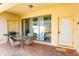 Patio with table, chairs, and grill, overlooking the pool at 2022 Majorca Dr, Kissimmee, FL 34747
