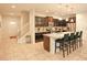 Modern kitchen with dark cabinets, granite island, and stainless steel appliances at 2022 Majorca Dr, Kissimmee, FL 34747