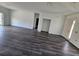 Spacious living room with dark gray vinyl flooring at 5115 Old Highway 37, Lakeland, FL 33811