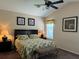 Spacious bedroom with king-size bed and ensuite bathroom at 1387 Lexington Ave, Davenport, FL 33837