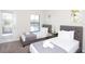 Two twin beds in a bright bedroom with patio access at 121 Kenny Blvd, Haines City, FL 33844