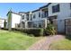Townhouse with private gated entrance and landscaped walkway at 121 Kenny Blvd, Haines City, FL 33844