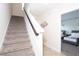 Carpeted staircase with dark wood railing at 121 Kenny Blvd, Haines City, FL 33844