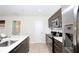 Modern kitchen with stainless steel appliances and an island at 121 Kenny Blvd, Haines City, FL 33844