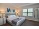 Spacious main bedroom with king-size bed and ample natural light at 121 Kenny Blvd, Haines City, FL 33844