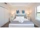 King-size bed, two nightstands, and large windows in this main bedroom at 121 Kenny Blvd, Haines City, FL 33844