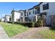 Townhouse exterior with walkway and landscaping at 121 Kenny Blvd, Haines City, FL 33844