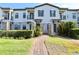 Townhouse with private gated entrance and landscaped walkway at 121 Kenny Blvd, Haines City, FL 33844