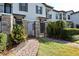 Townhouse with private gated entrance and landscaped walkway at 121 Kenny Blvd, Haines City, FL 33844