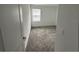 Light-filled bedroom with carpeted floor at 11438 Rhyme Ave, Orlando, FL 32832