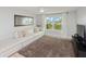 Bright living room with a sectional sofa, large window, and a flat-screen TV at 3241 Wauseon Dr, St Cloud, FL 34772