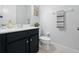 Clean bathroom with dark vanity and modern fixtures at 3241 Wauseon Dr, St Cloud, FL 34772