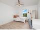 Cozy bedroom featuring a window seat and a well-lit workspace at 3241 Wauseon Dr, St Cloud, FL 34772