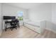 Spacious bedroom with a daybed and a desk for a home office at 3241 Wauseon Dr, St Cloud, FL 34772