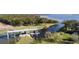 Aerial view of a neighborhood boat ramp with a covered dock at 3241 Wauseon Dr, St Cloud, FL 34772