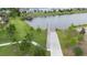 Aerial view of a wooden dock extending over a calm lake at 3241 Wauseon Dr, St Cloud, FL 34772