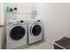 Bright laundry room with washer, dryer, and shelving at 3241 Wauseon Dr, St Cloud, FL 34772