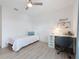 Bright bedroom with built-in workspace and plush bedding at 3241 Wauseon Dr, St Cloud, FL 34772